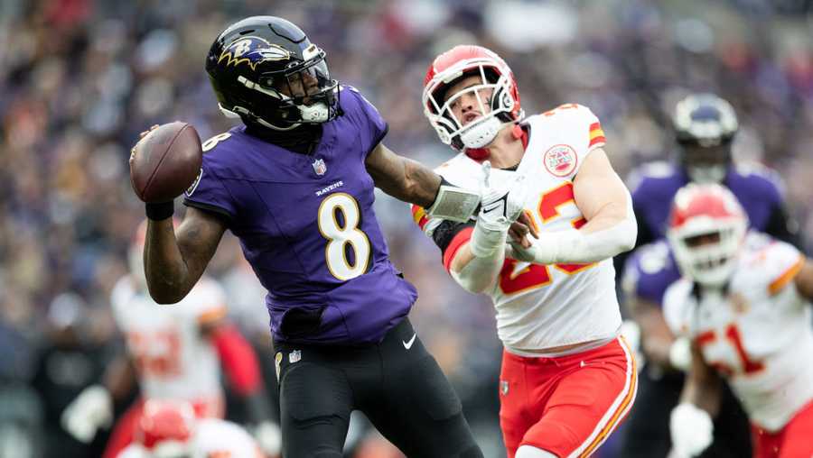 BALTIMORE, MARYLAND - JANUARY 28: Lamar Jackson #8 of the Baltimore Ravens attempts to throw a pass as Drue Tranquill #23 of the Kansas City Chiefs defends during the AFC Championship NFL football game at M&T Bank Stadium on January 28, 2024 in Baltimore, Maryland. (Photo by Kara Durrette/Getty Images) SOURCE: Kara Durrette/Getty Images