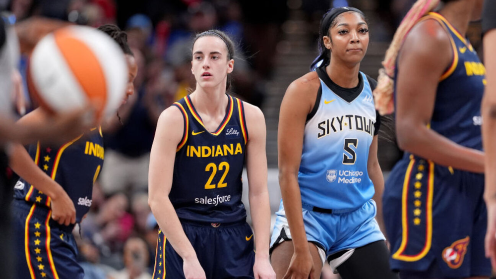 INDIANAPOLIS, INDIANA - JUNE 16: Caitlin Clark #22 of the Indiana Fever and Angel Reese #5 of the Chicago Sky look on during a game at Gainbridge Fieldhouse on June 16, 2024 in Indianapolis, Indiana. Emilee Chinn/Getty Images