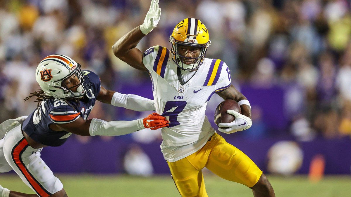 October 14, 2023: LSU's Malik Nabers (8) tries to escape from the grasp of Auburn's Champ Anthony (25) during the NCAA football game between the Auburn Tigers and the LSU Tigers at Tiger Stadium in Baton Rouge, LA. Kyle Okita/CSM (Credit Image: © Kyle Okita/Cal Sport Media) (Cal Sport Media via AP Images)