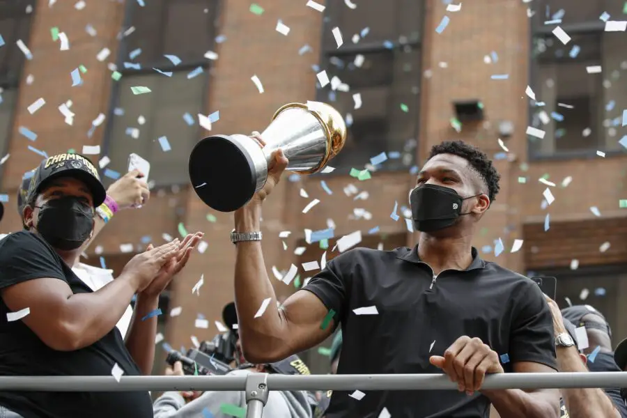 Jul 22, 2021; Milwaukee, WI, USA; Milwaukee Bucks forward Giannis Antetokounmpo (34) holds his NBA Finals MVP Trophy during the Milwaukee Bucks victory parade. Mandatory Credit: Kamil Krzaczynski-USA TODAY Sports