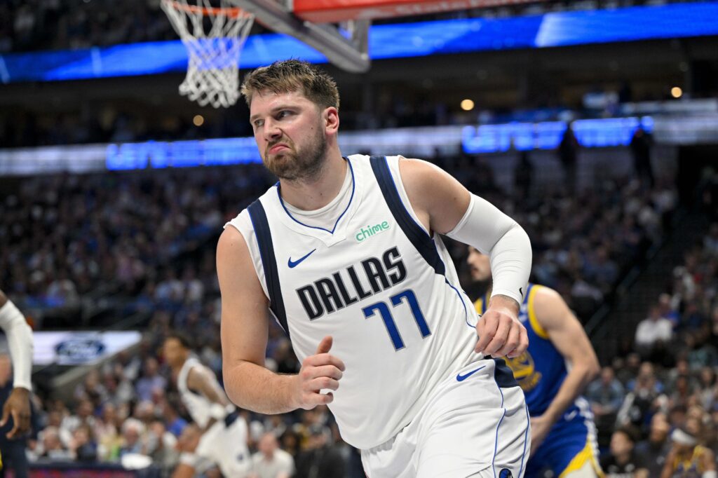 Mar 13, 2024; Dallas, Texas, USA; Dallas Mavericks guard Luka Doncic (77) reacts to making a basket against the Golden State Warriors during the first half at the American Airlines Center. Mandatory Credit: Jerome Miron-USA TODAY Sports