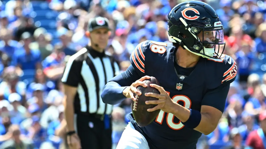 Caleb Williams moves out of the pocket with eyes downfield in his Bears debut. | Mark Konezny-USA TODAY Sports