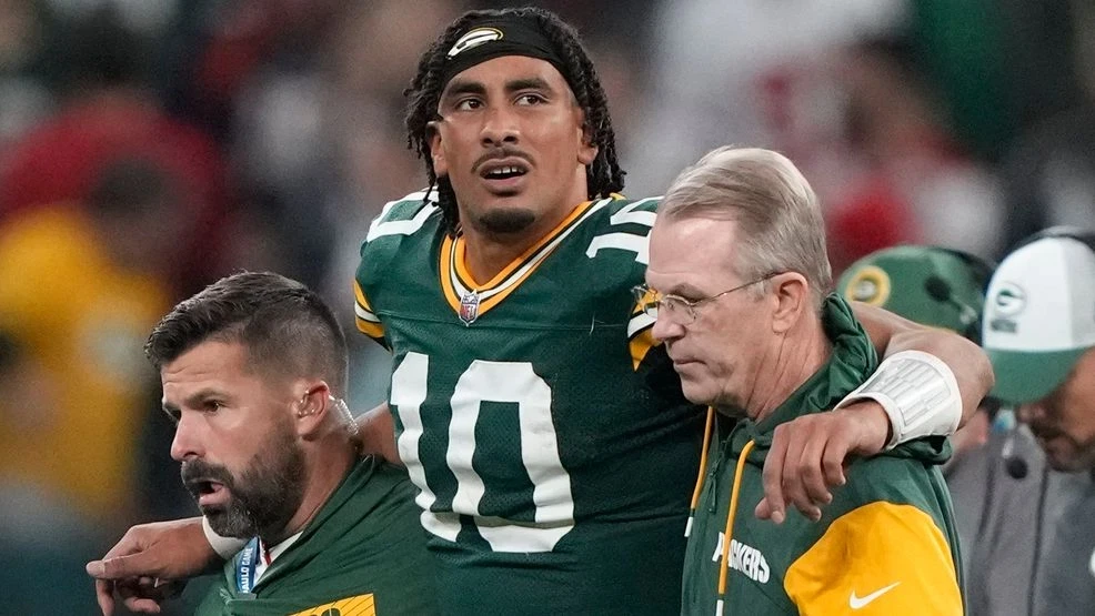 Green Bay Packers quarterback Jordan Love (10) in helped off the field after getting hurt during the second half of an NFL football game against the Philadelphia Eagles, Saturday, Sept. 7, 2024, at the Neo Quimica Arena in Sao Paulo. (AP Photo/Doug Benc)